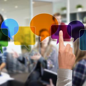 Photo of people in a group discussing innovative research