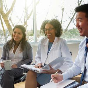 Photo of health professionals in team-based care meeting