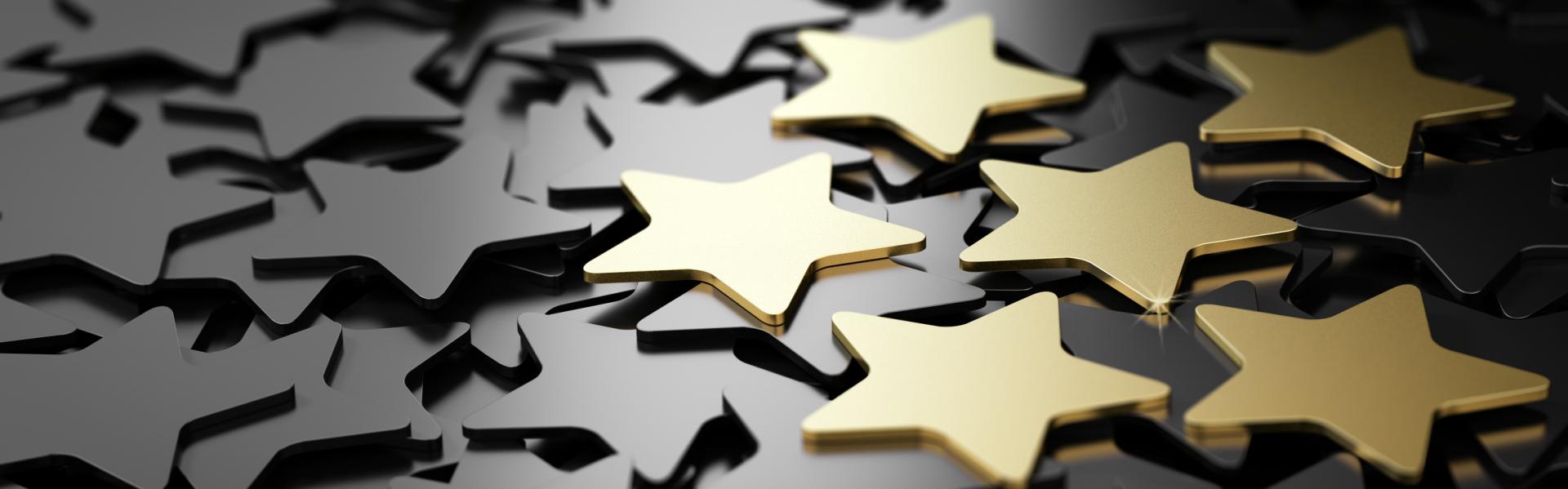 Photo of gold stars standing out from grey stars